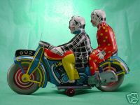 OU2 CLOWNS ON MOTORCYCLE (METTOY)